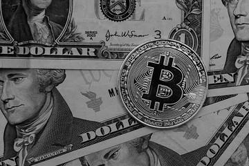 Bitcoins with US banknotes, golden bitcoin, silver bitcoin, bronze bitcoin. New virtual money.