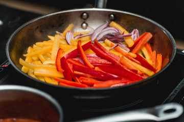 chef making healthy fresh fajitas or fajitos with beef. Easy, but tasty, healthy. National Mexican food, fresh oganic food.