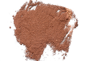 scattered ground coffee isolated on white background