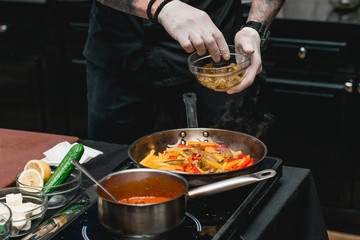chef making healthy fresh fajitas or fajitos with beef. Easy, but tasty, healthy. National Mexican food, fresh oganic food.