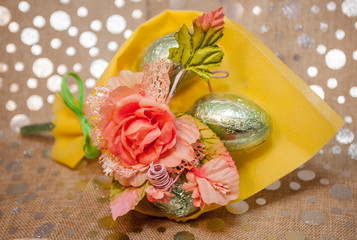 Bouquet of cloth flowers with chocolate eggs