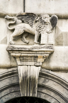 Closeup Lion Stone Sculpture over Marble Entrance Arch