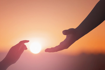 helping hand outstretched for salvation on isolated toned background
