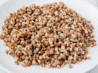 Buckwheat porridge in a plate, healthy food.