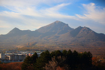 city view at the foot of the mountain. Sunny day, early autumn.