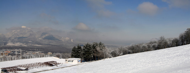 mountain view of the city and another mountain winter