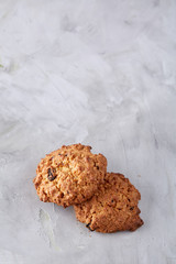Sweet biscuits arranged in pattern on light textured background, close-up, shallow depth of field, selective focus.