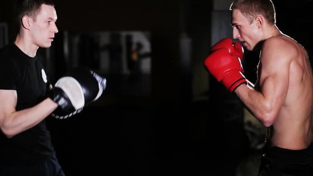 Man Trains Boxing with Trainer