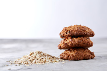 Sweet biscuits arranged in pattern on light textured background, close-up, shallow depth of field, selective focus.