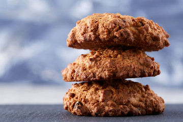 Sweet biscuits arranged in pattern on light textured background, close-up, shallow depth of field, selective focus.