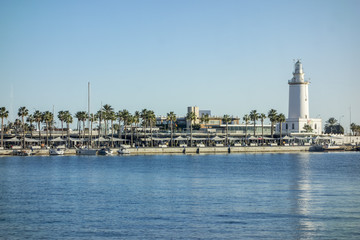 Fototapeta na wymiar Port view and tower lighthouse, Malaga, Spain.