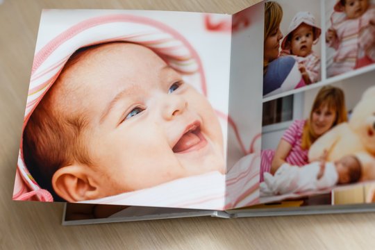 Close up looking at baby s album