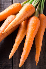 Carrots on a dark wooden table