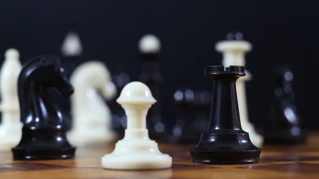 Game of chess. Friends in the competition play chess. World Chess Tournament. Victory and defeat. Checkmate. Bracing. King and Queen.