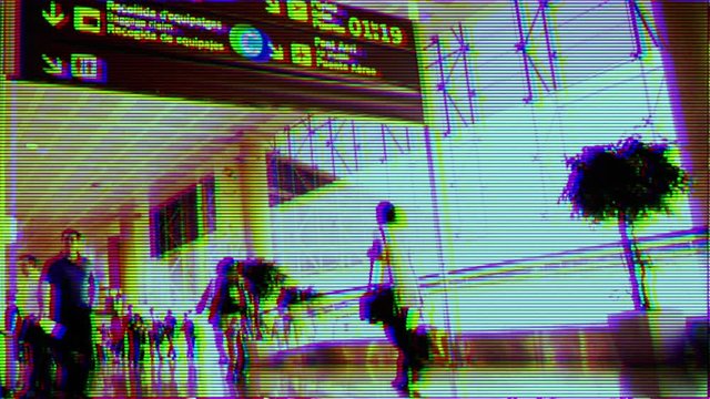 people rushing around at airport terminal with overlayed effect to make it look like cctv security footage.