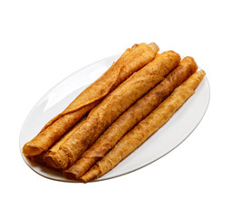 Stack of delicious pancakes on plate isolated on white