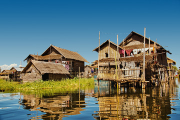 Fototapeta na wymiar View of houses in a floating village on Inle lake in Myanmar