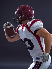 Fototapeta premium American football Player running with the ball