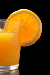 Orange juice on black background