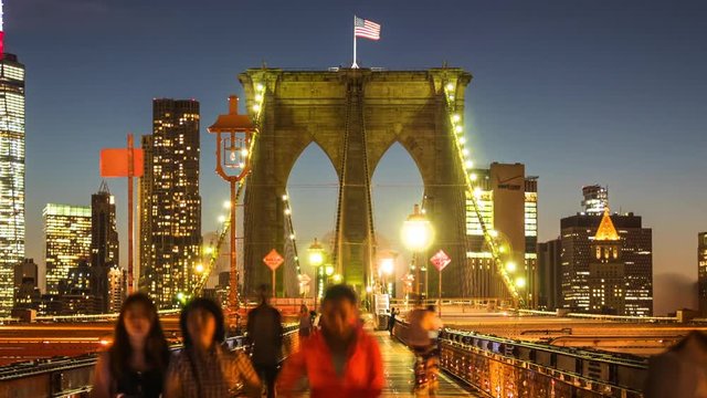 New York City, United States, time lapse view of Brooklyn Bridge at nighttime. Zoom out.