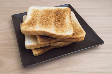 bread toast on a dark plate