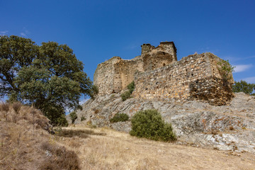 Fototapeta na wymiar Ruined Alba castle over the rocks against blue sky