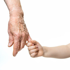 Hands. Grandmother's and grandchild's hands. Grannie's and kid's hands over white. Elderly and children hands closep, isolated on white background.