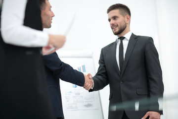 closeup of a business handshake partners.