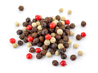 Black, red and white peppercorns isolated on white background. Heap of spice. Mix of different...
