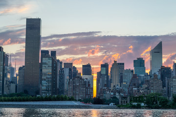 Skyline of the east side of midtown Manhattan at sunset
