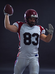 american football player throwing ball