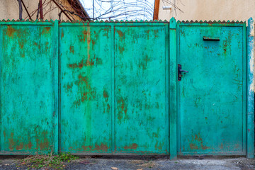 Old green fence and door.