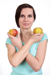 Fototapeta na wymiar The girl holds apples in the crossed hand