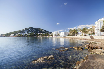  Mediterranean beach in balearic town of Santa Eularia des Riu, Ibiza, Spain.