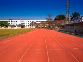 Athletics stadium running track red lines marks.