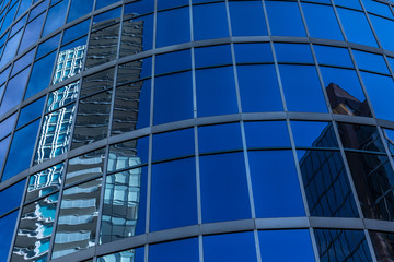 Obraz premium Reflections on glass buildings.