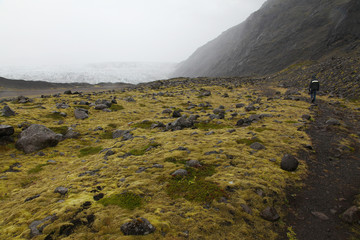 A lonely man on an Icelandic road in a fog