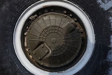 The wheel of a fighting vehicle standing in the park