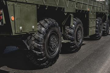 The wheel of a fighting vehicle standing in the park