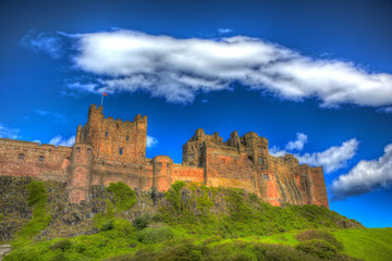Fototapeta na wymiar English medieval castle Bamburgh Northumberland north east England UK in colourful hdr