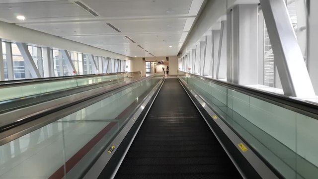 Moving travelator in the overhead passage of subway, Dubai, UAE