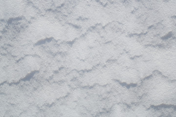 Fototapeta na wymiar Snow dunes texture, background with copy space
