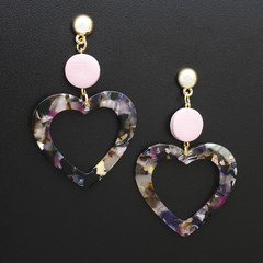 earrings hearts in the style of the eighties, isolated on black