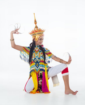 The lady in Southern thai classical dancing suit is posing on white background.