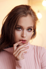 Fototapeta premium beautiful young woman with natural hair and makeup in casual clothes