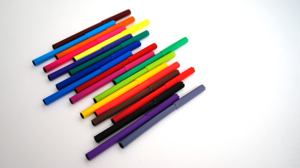 multi-colored felt-tip pens on the white isolated background, 18 colors.