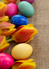 Spring tulips with colorful easter eggs.