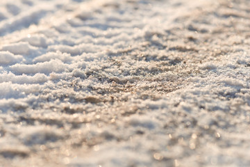 Tire tracks in the frozen snow - ice - detail