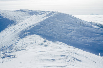 Hills of Gorgany mountains covered with snow