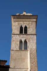 Fototapeta na wymiar Corsica, 05/09/2017: il campanile della Basilica di Santa Maria Maggiore, la chiesa cattolica in stile romanico di Bonifacio, nel sud della Corsica